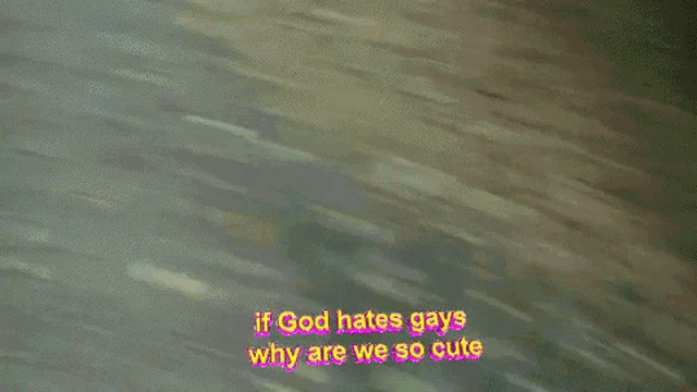 a blurry picture of a man standing in the woods with the words if god hates gays why are we so cute above him