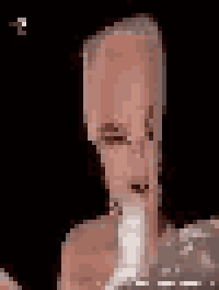 a close up of a person 's face with a large head holding a bottle .