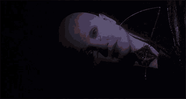 a close up of a person 's face with blood coming out of it 's mouth