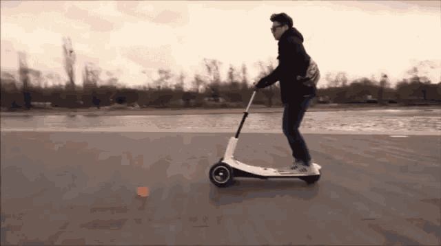 Cool Guy On Electric Scooter GIF - Electric Scooter Scooter Cool Guy GIFs