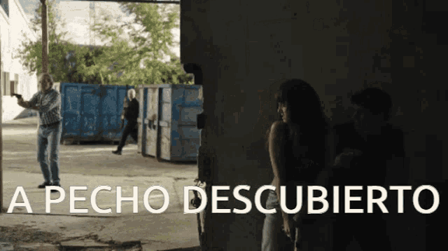 a group of people are standing in a dark room with the words a pecho descubierto written in white