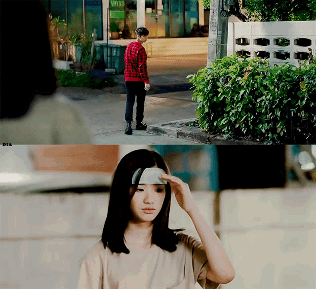a girl with a bandage on her forehead is standing in front of a building that says w13