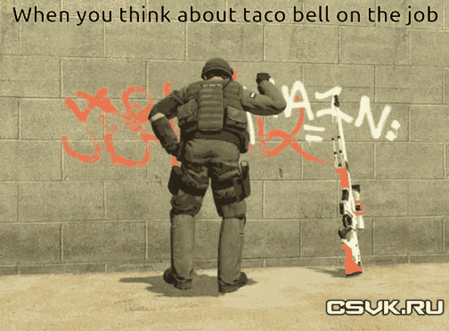 a soldier is standing in front of a wall with graffiti on it that says pain
