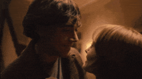 a man and a woman are looking into each others eyes