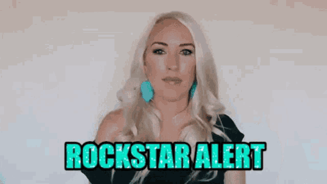 a woman is giving a thumbs up and the words rockstar alert are on the screen behind her