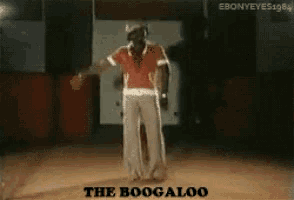 a man in a red shirt is dancing with the words the boogaloo above him