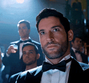 a man in a tuxedo with a bow tie