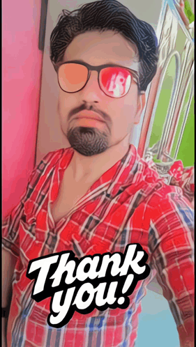 a man wearing sunglasses and a plaid shirt has a thank you sticker on his shirt