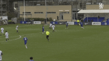 a soccer game is being played on a field with a player named harrison mcgraw on the screen