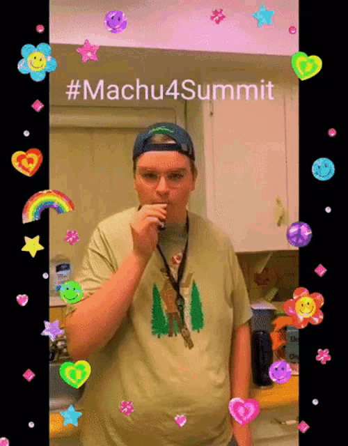 a man in a t-shirt with trees on it is surrounded by colorful stickers and the words #machu4summit