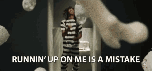 a man in a striped shirt is standing in a bathroom with the words runnin ' up on me is a mistake behind him