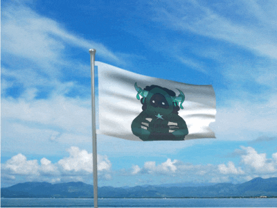 a flag with a monster on it is flying in front of a body of water