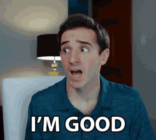 a man in a blue shirt is making a surprised face and saying i 'm good .