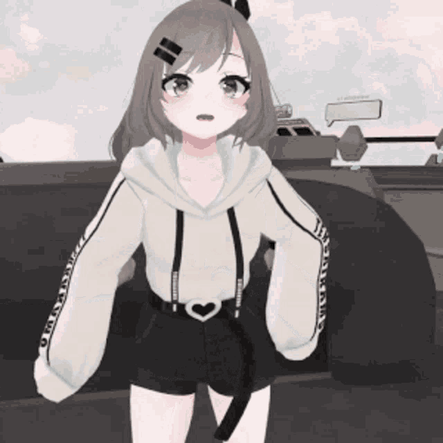a girl wearing a white hoodie with a heart on the sleeves