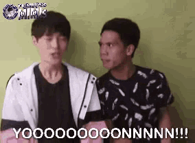 two men are standing next to each other and one of them is saying yoooooo onnnn !!!