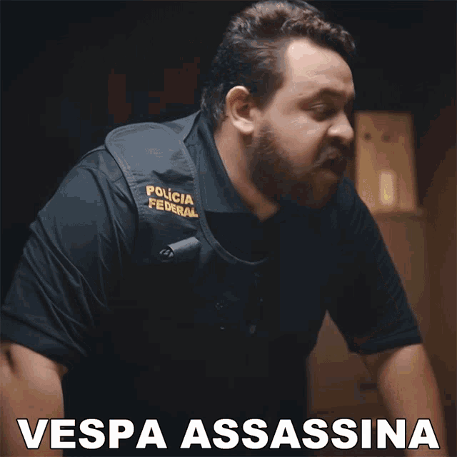 a man with a beard wearing a vest that says policia federal