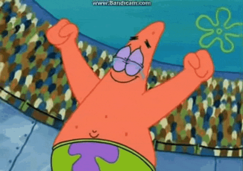 patrick star from spongebob squarepants is holding a red ball in his hands .