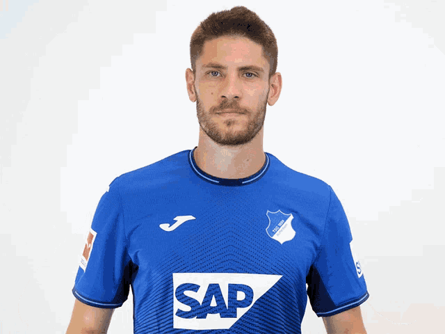 a man wearing a blue shirt that says sap