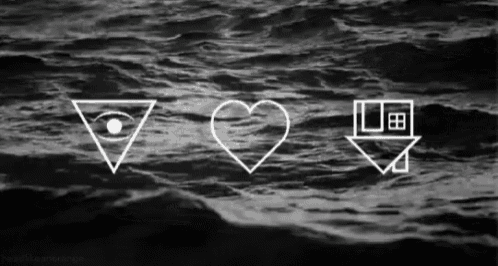 a black and white photo of a triangle , a heart , and a house in the ocean .