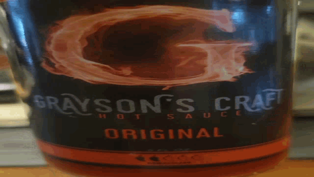 a blurred image of a container with a red stripe on it
