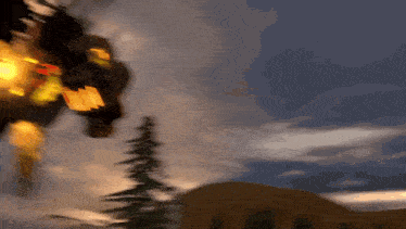 a blurry picture of a person flying through the air with a flame coming out of their chest