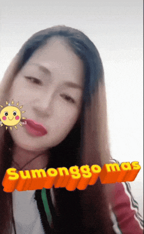 a woman with a sun on her face and the words sumonggo mas