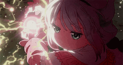 a girl in a pink dress is holding a pink object in her hand .