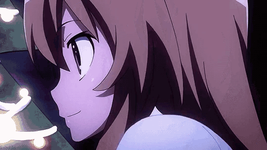 a close up of a girl 's face with a purple background and a christmas tree in the background .