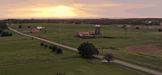 an aerial view of a farm with the words " i still " written in the grass