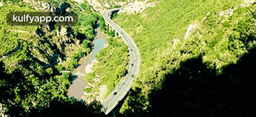 an aerial view of a road with the website kulfyapp.com visible