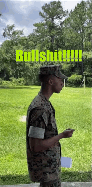 a man in a military uniform is standing in a grassy field with the words bullshit written in green