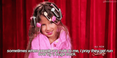 a little girl with curlers in her hair is standing in front of a red curtain and saying sometimes when people are rude to me