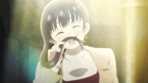 a girl with a fake mustache is smiling and making a face