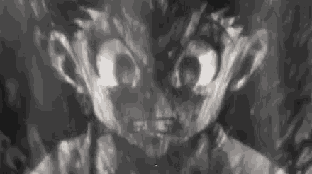 a close up of a person 's face with a very angry look on their face in a black and white photo .