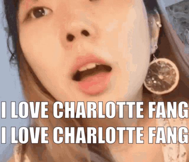 a close up of a woman 's face with the words " i love charlotte fang i love charlotte fang " above her