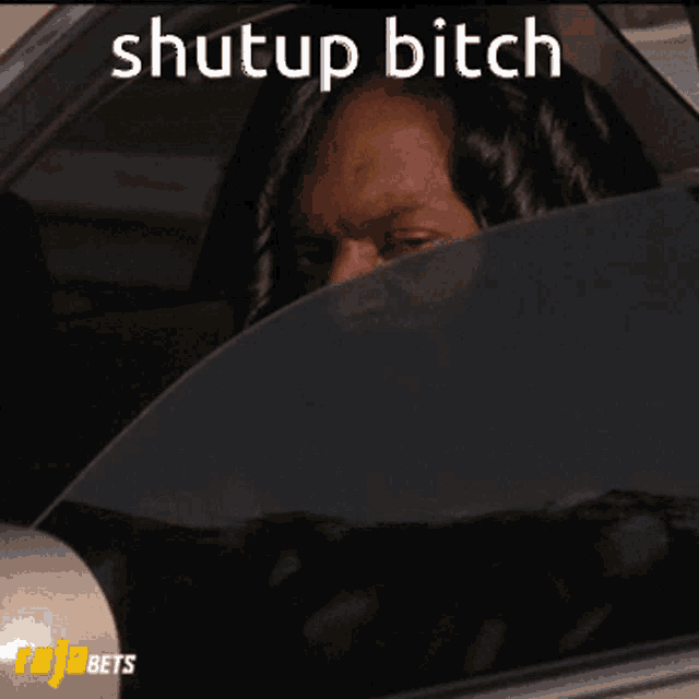 a picture of snoop dogg in a car with the words shut up bitch above him