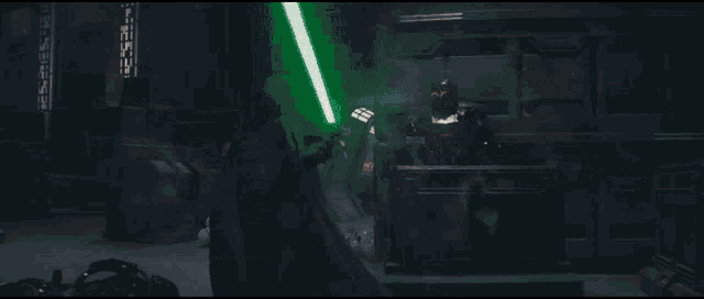 a person is welding a piece of metal with a green light coming out of it