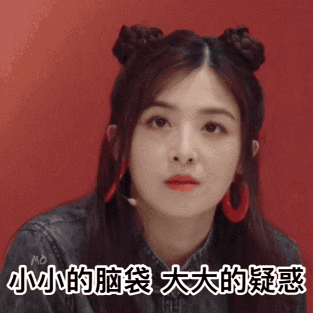 a woman with two buns on her hair and chinese writing