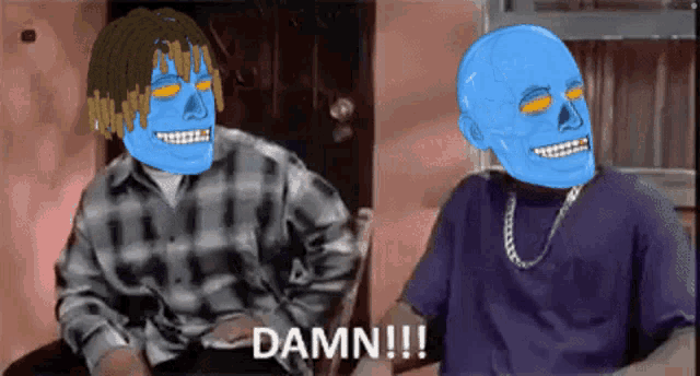 two blue skulls are sitting next to each other and one of them is saying damn