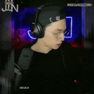 a young man wearing headphones and glasses says big love