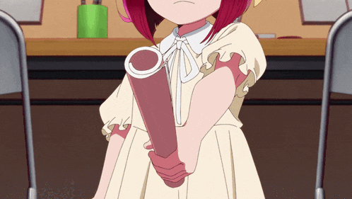a girl in a white dress is holding a piece of paper in her hand