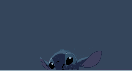 stitch from disney 's lilo and stitch is peeking out from behind a blue wall .