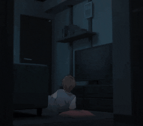 a person laying on the floor in front of a tv