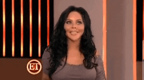 a woman stands in front of an et logo