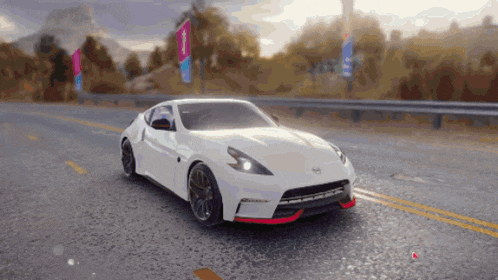 a white sports car is driving down a road in a video game