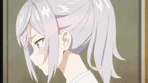 a close up of a girl 's face with white hair