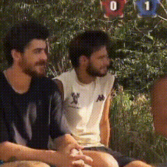 a group of men are sitting under a tree with numbers 0 and 1 on them .