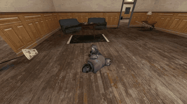 a person laying on the floor in a living room with a couch