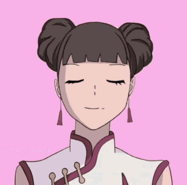 a cartoon girl with two buns in her hair and earrings is smiling .