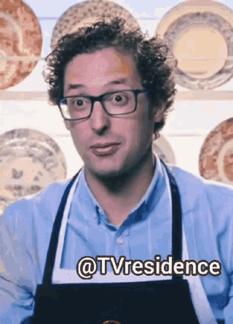 a man wearing glasses and an apron says " @tvresidence " on the bottom
